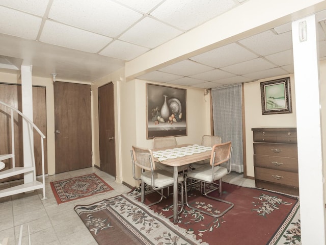 4249 W Melrose St, Chicago, IL 60641 - dining room featuring stairs, a paneled ceiling, and baseboards