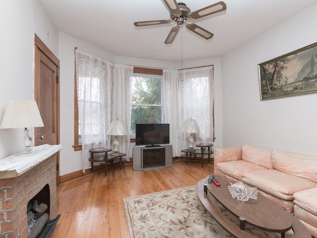 4249 W Melrose St, Chicago, IL 60641 - living room with wood-type flooring, a ceiling fan, and a brick fireplace