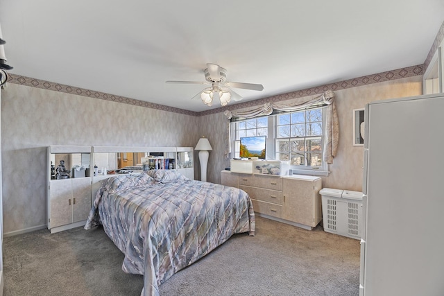 bedroom featuring wallpapered walls, carpet, a ceiling fan, and baseboards