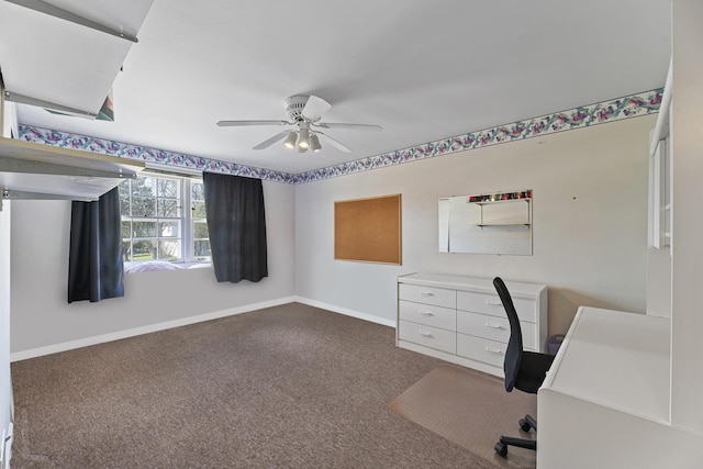 unfurnished office featuring ceiling fan, carpet floors, and baseboards
