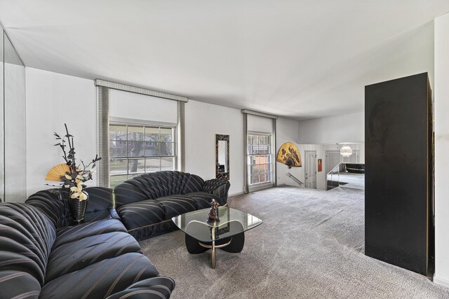 living room with a wealth of natural light and carpet