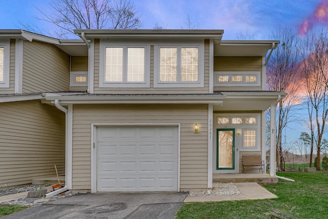 26247 N Green St Unit 2F, Mundelein, IL 60060 - view of front of house with a porch, aphalt driveway, and a garage