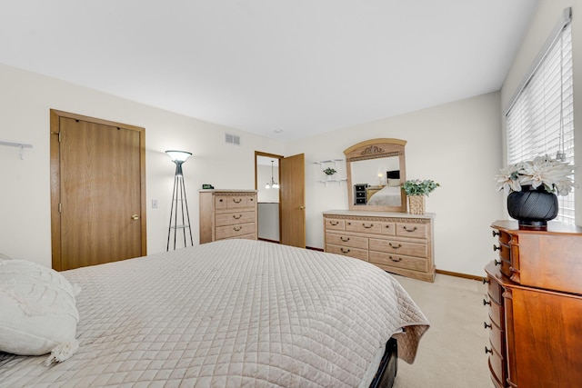 26247 N Green St Unit 2F, Mundelein, IL 60060 - bedroom with visible vents, baseboards, and light carpet