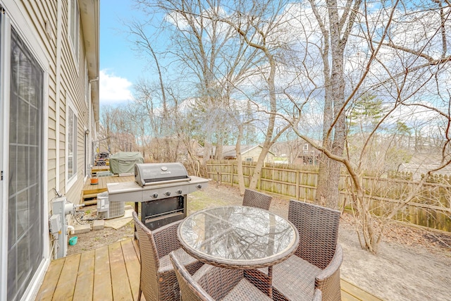 26247 N Green St Unit 2F, Mundelein, IL 60060 - deck with outdoor dining space and a fenced backyard