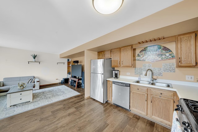 26247 N Green St Unit 2F, Mundelein, IL 60060 - kitchen with light brown cabinetry, stainless steel appliances, light countertops, a sink, and open floor plan