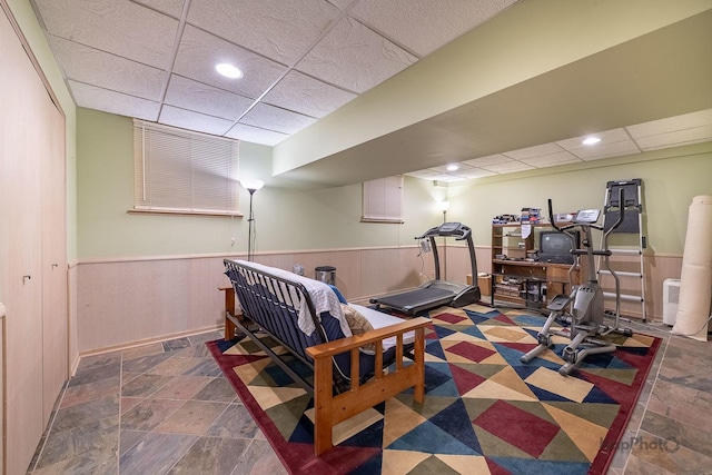 851 Bluestem Dr, Bolingbrook, IL 60440 - workout room featuring a wainscoted wall, stone finish floor, a paneled ceiling, and recessed lighting