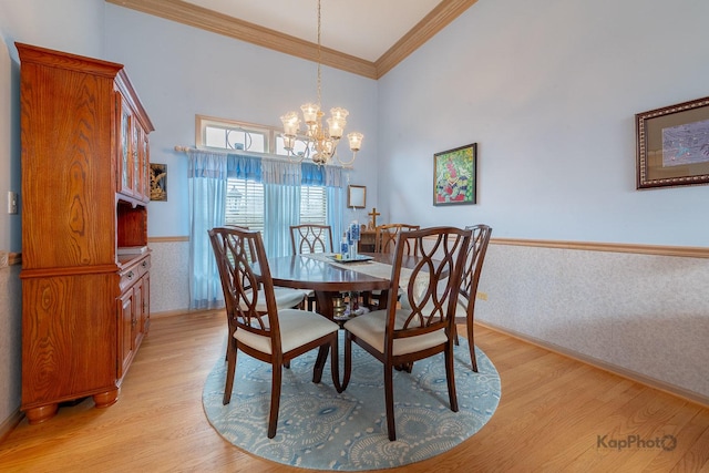 851 Bluestem Dr, Bolingbrook, IL 60440 - dining area with crown molding, a wainscoted wall, light wood-type flooring, and an inviting chandelier