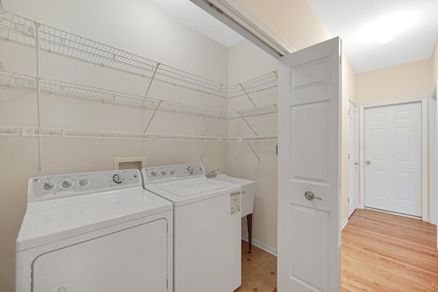9154 Arbour Walk Dr, Frankfort, IL 60423 - laundry room with independent washer and dryer, baseboards, and light wood-type flooring