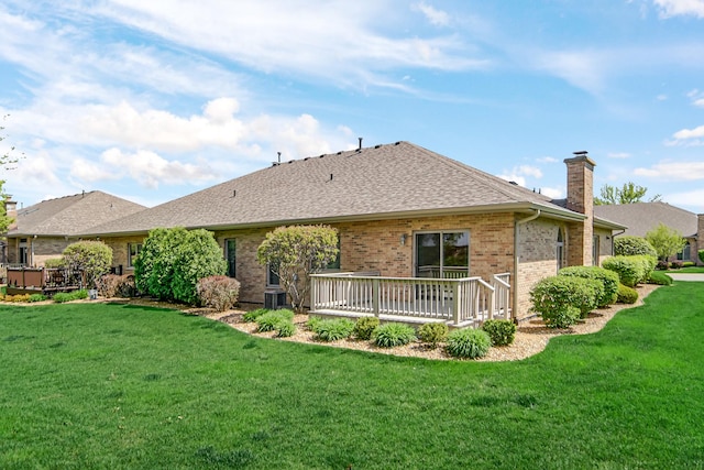 9154 Arbour Walk Dr, Frankfort, IL 60423 - back of property with a chimney, brick siding, a wooden deck, and a yard