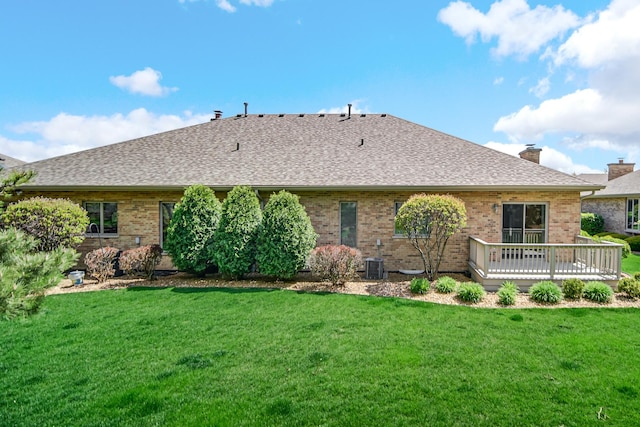 9154 Arbour Walk Dr, Frankfort, IL 60423 - rear view of house featuring a deck, brick siding, a lawn, and roof with shingles