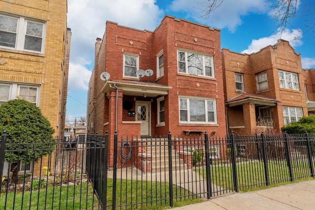 5048 W Wrightwood Ave, Chicago, IL 60639 - view of front of property featuring a fenced front yard and brick siding