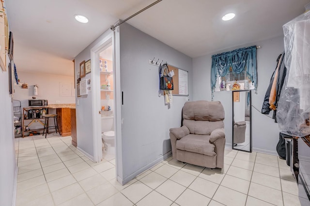 5048 W Wrightwood Ave, Chicago, IL 60639 - living area with recessed lighting and light tile patterned floors