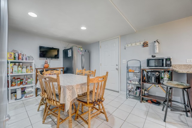 5048 W Wrightwood Ave, Chicago, IL 60639 - dining area with light tile patterned floors and recessed lighting