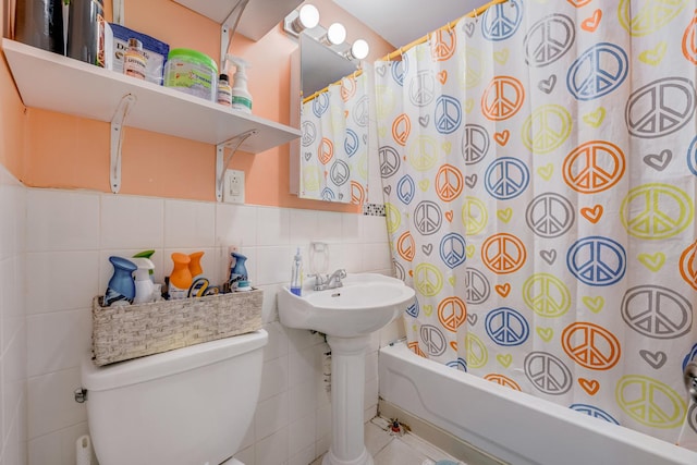 5048 W Wrightwood Ave, Chicago, IL 60639 - bathroom featuring tile walls, shower / bath combination with curtain, and a wainscoted wall