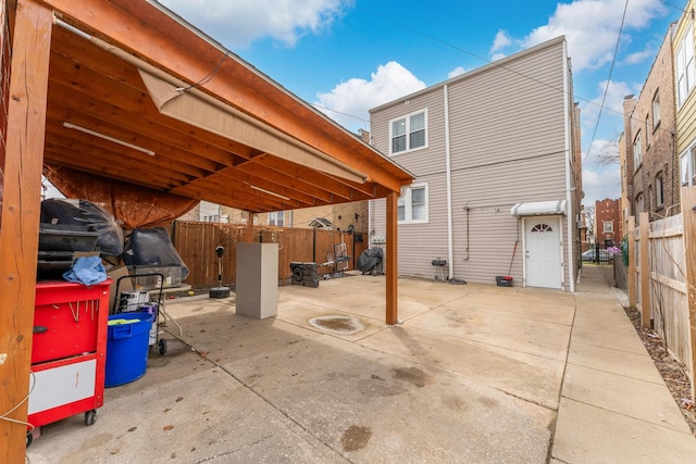 5048 W Wrightwood Ave, Chicago, IL 60639 - rear view of house with a fenced backyard and a patio