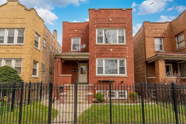 5048 W Wrightwood Ave, Chicago, IL 60639 - view of front facade featuring brick siding and a fenced front yard