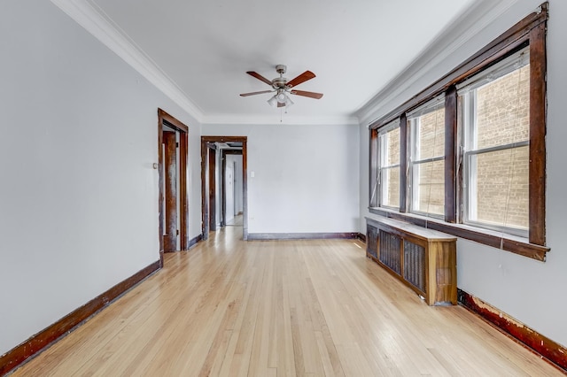 5048 W Wrightwood Ave, Chicago, IL 60639 - empty room featuring light wood finished floors, crown molding, and a ceiling fan