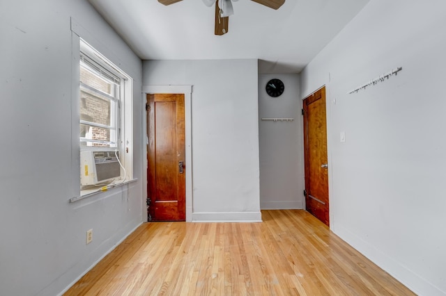 5048 W Wrightwood Ave, Chicago, IL 60639 - unfurnished bedroom with light wood-style flooring, cooling unit, and ceiling fan