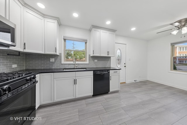 8800 44th Pl, Brookfield, IL 60513 - kitchen with black appliances, dark countertops, decorative backsplash, healthy amount of natural light, and recessed lighting