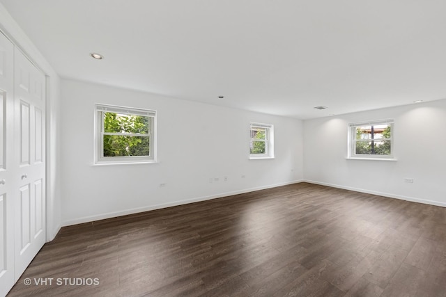 8800 44th Pl, Brookfield, IL 60513 - unfurnished bedroom with dark wood-style floors and recessed lighting