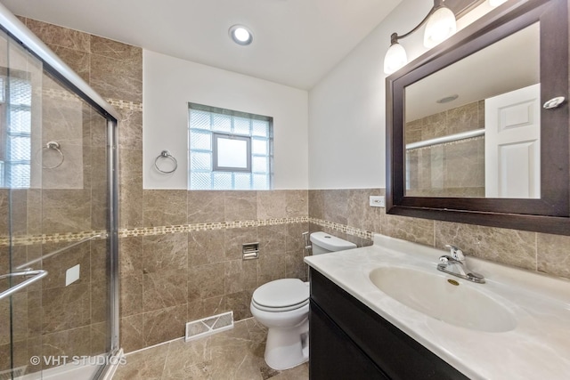 8800 44th Pl, Brookfield, IL 60513 - bathroom with tile walls, vanity, a stall shower, and wainscoting