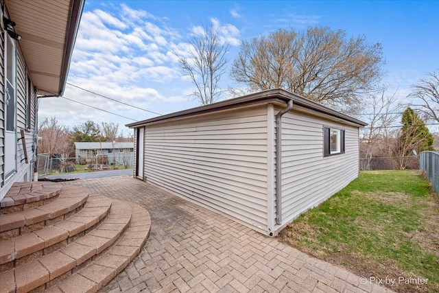 exterior space with an outbuilding and fence
