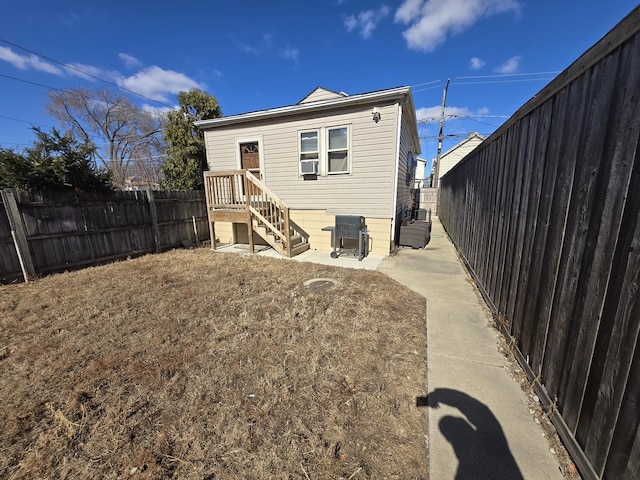 5750 W 65th St, Chicago, IL 60638 - back of property featuring a fenced backyard and a patio area
