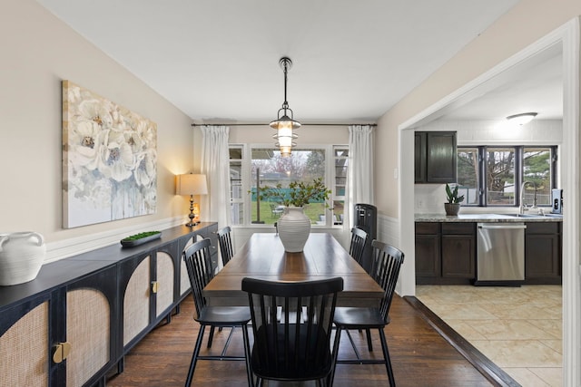 dining area with light wood-style flooring