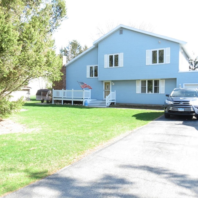 10902 E French St, Grant Park, IL 60940 - rear view of property with a yard and a wooden deck