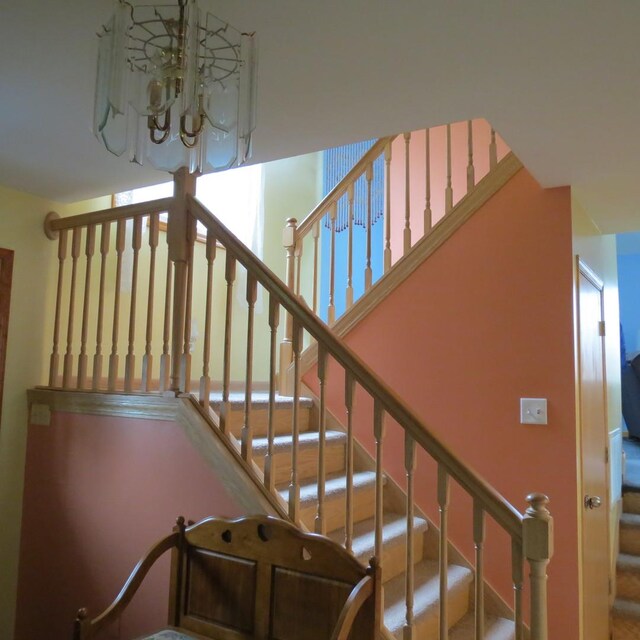 10902 E French St, Grant Park, IL 60940 - stairway with an inviting chandelier