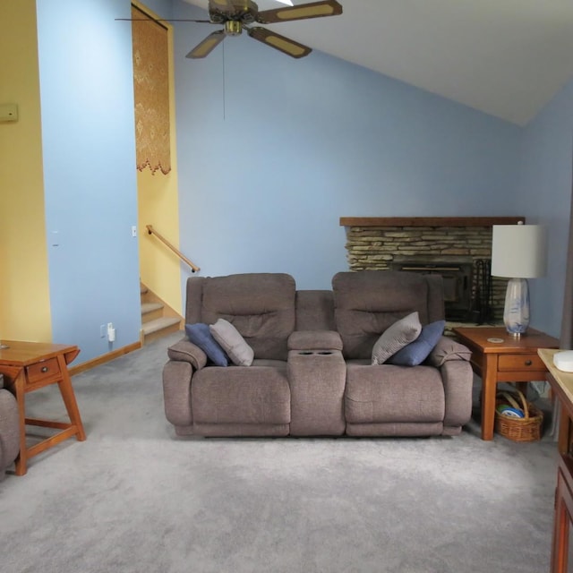 10902 E French St, Grant Park, IL 60940 - carpeted living room with baseboards, ceiling fan, a fireplace, stairway, and vaulted ceiling