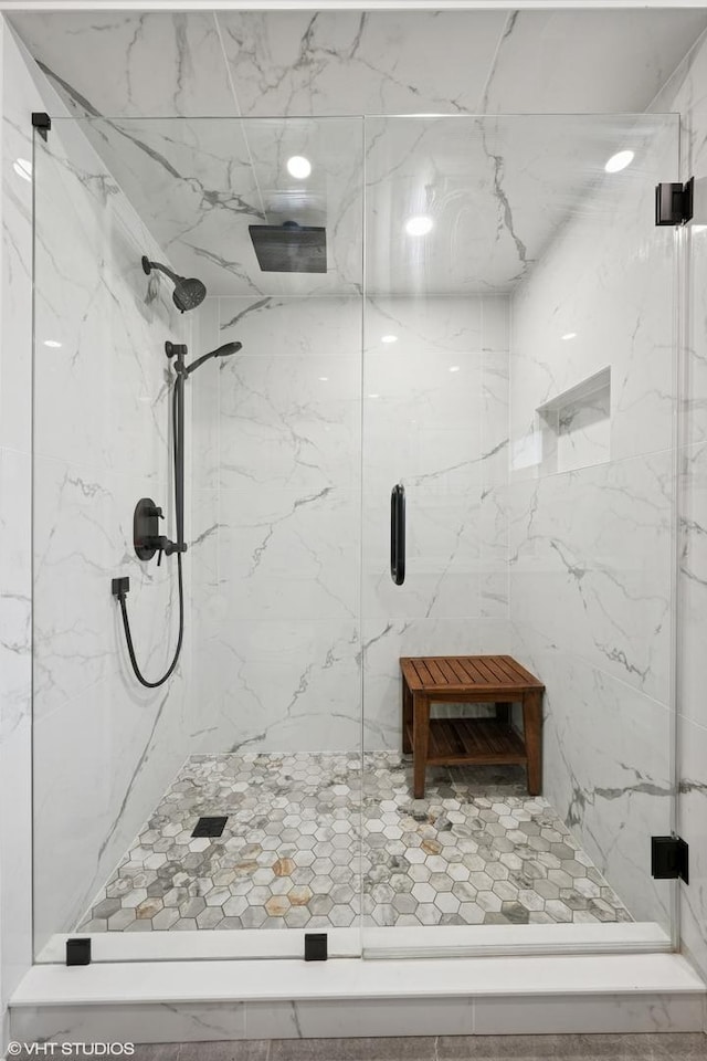 bathroom with a marble finish shower