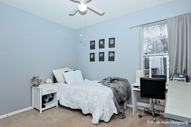 bedroom featuring carpet, baseboards, and a ceiling fan