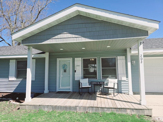 exterior space with an attached garage and covered porch