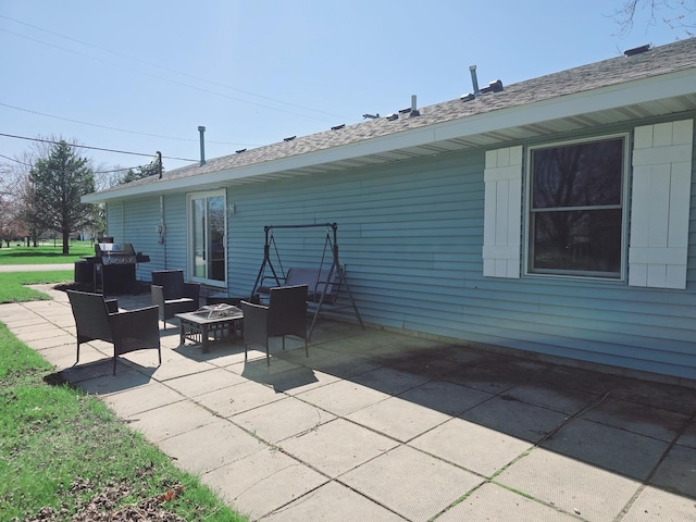 view of patio with a fire pit