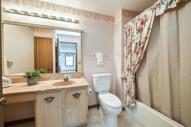 full bathroom with shower / bath combo, toilet, vanity, and baseboards