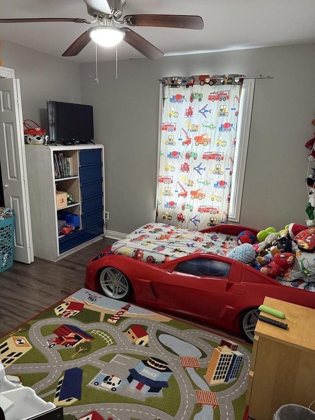 bedroom with ceiling fan and wood finished floors