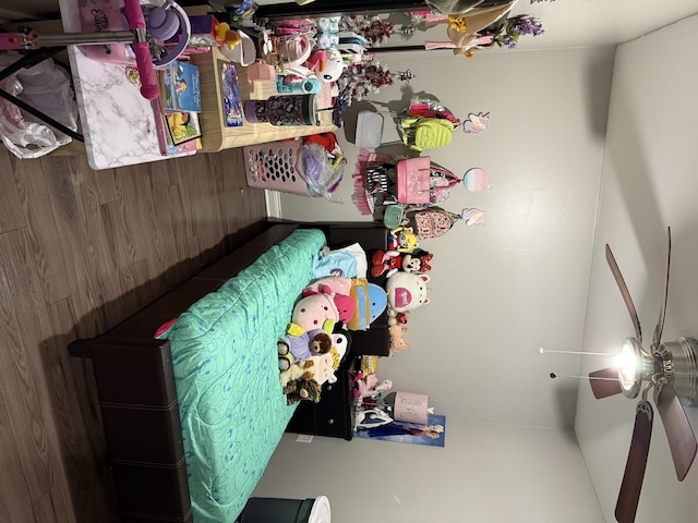 bedroom featuring wood walls