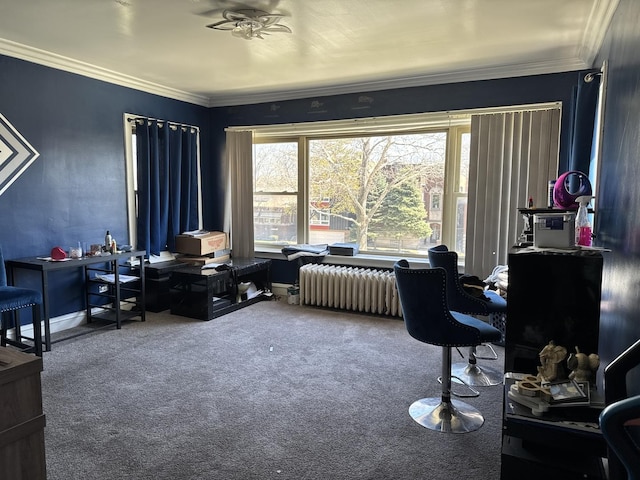 carpeted office space featuring crown molding, radiator heating unit, and a ceiling fan