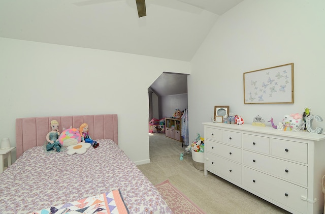 bedroom with ceiling fan, light colored carpet, and lofted ceiling