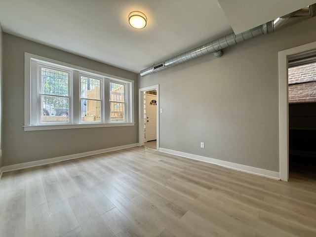 1824 W 22nd Pl, Chicago, IL 60608 - unfurnished room with light wood-type flooring and baseboards