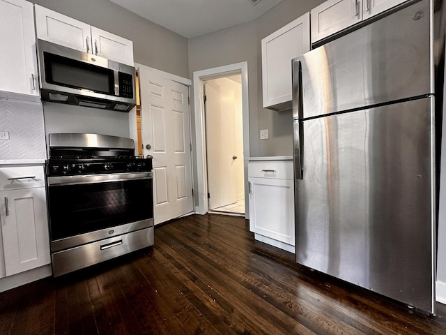 1824 W 22nd Pl, Chicago, IL 60608 - kitchen with stainless steel appliances, dark wood finished floors, white cabinetry, and light countertops