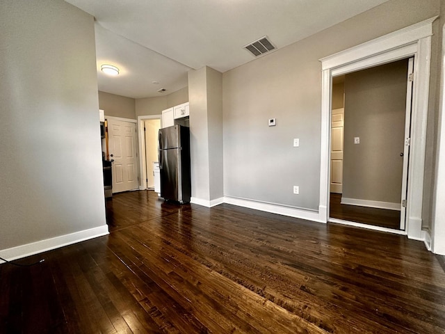 1824 W 22nd Pl, Chicago, IL 60608 - spare room featuring dark wood-style flooring and baseboards