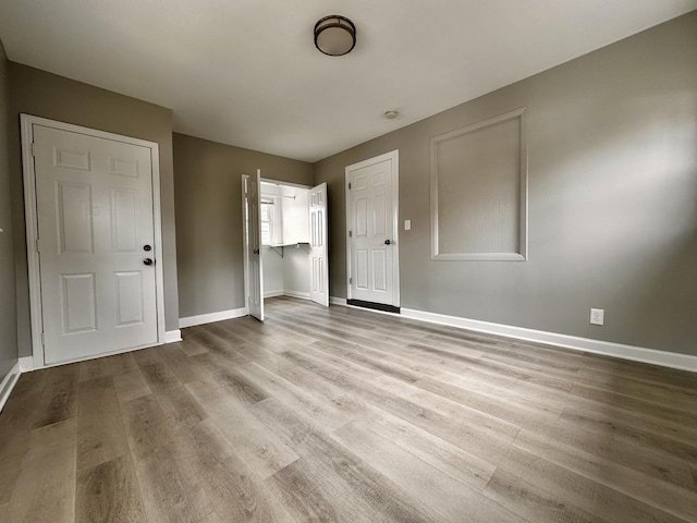 1824 W 22nd Pl, Chicago, IL 60608 - unfurnished bedroom with wood finished floors and baseboards