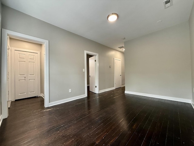 1824 W 22nd Pl, Chicago, IL 60608 - empty room featuring dark wood-style flooring and baseboards