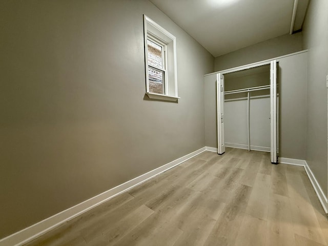 1824 W 22nd Pl, Chicago, IL 60608 - unfurnished bedroom with light wood-style floors and a closet