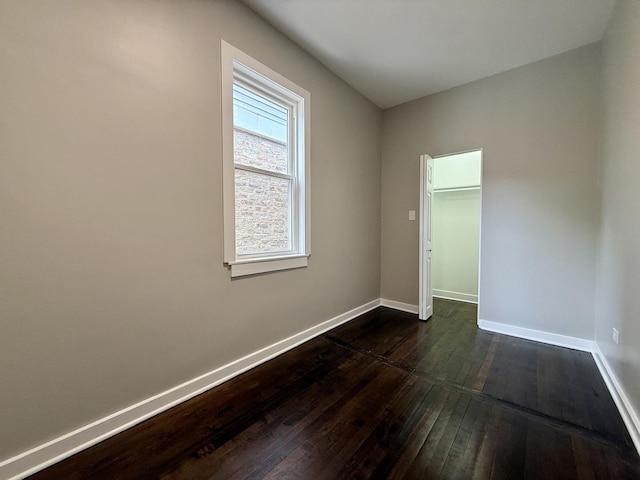 1824 W 22nd Pl, Chicago, IL 60608 - unfurnished room with dark wood-style flooring and baseboards