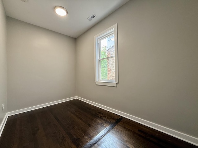 1824 W 22nd Pl, Chicago, IL 60608 - empty room featuring dark wood finished floors and baseboards