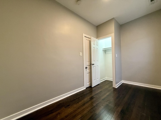 1824 W 22nd Pl, Chicago, IL 60608 - empty room featuring dark wood-style floors and a smoke detector