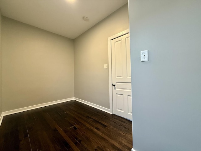 1824 W 22nd Pl, Chicago, IL 60608 - empty room featuring dark wood-style floors and a smoke detector